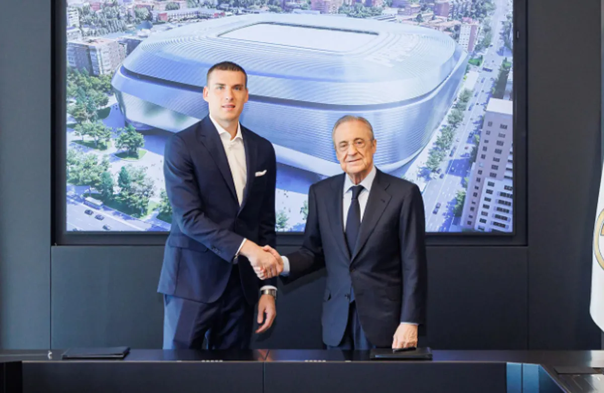 Andriy Lunin y Florentino Pérez.