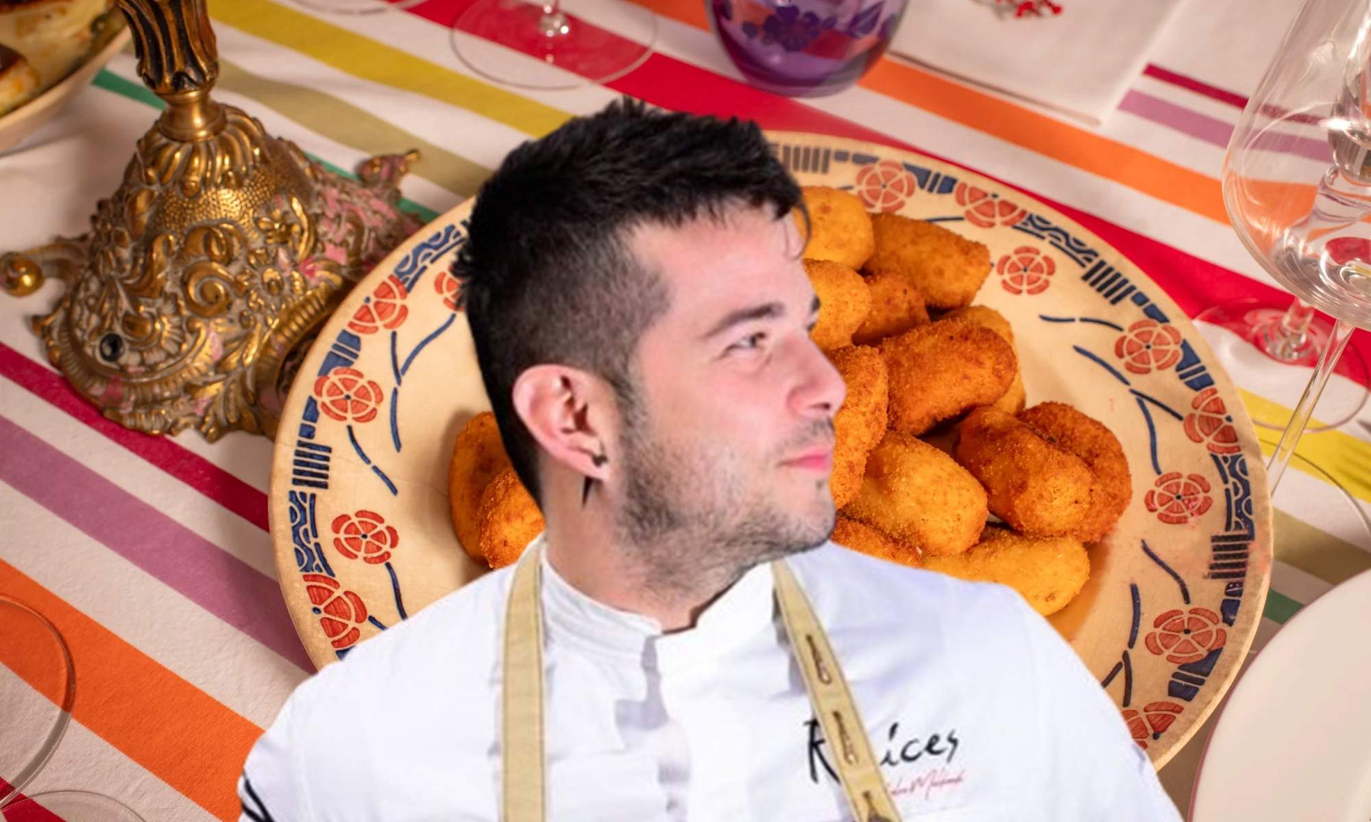 Carlos Maldonado y un plato de croquetas.